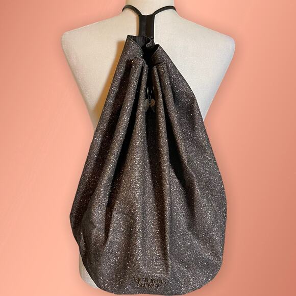 SPARKLY BLACK DRAWSTRING BACKPACK WITH DECORATIVE ANGEL CHARM - Picture 1 of 4